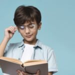young-boy-reading-with-copy-space-scaled-1
